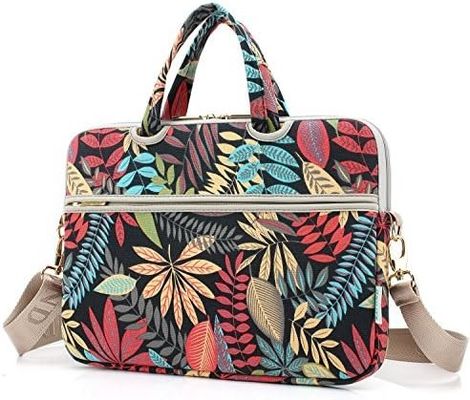 12.5~14인치 노트북용으로 디자인된 노트북 가방으로, 패딩 처리된 내부 프린트 캔버스 원단과 다양한 휴대 옵션을 제공합니다.